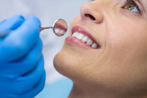a dental patient undergoing a dental cleaning and oral health check